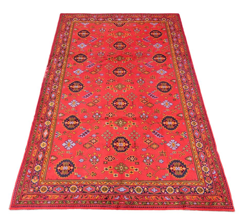 A Donegal carpet, in Turkish style, Ireland, early 20th century, 548 x 344cm.