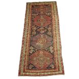 A fine Kuba long rug, north east Caucasus, second half 19th century, 325 x 144.4cm.
 
Lot 22 –