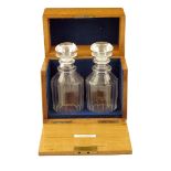 λ A Victorian oak decanter box, the hinged lid with a sunken brass handle inscribed 'ROBERT ELLIS