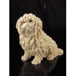 A Victorian carved Meershaum model of a Bolognese terrier, with glass eyes under a glass dome on