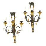 A pair of Italian ebonised and giltwood three light wall appliques in Empire style, modern, 61.2cm