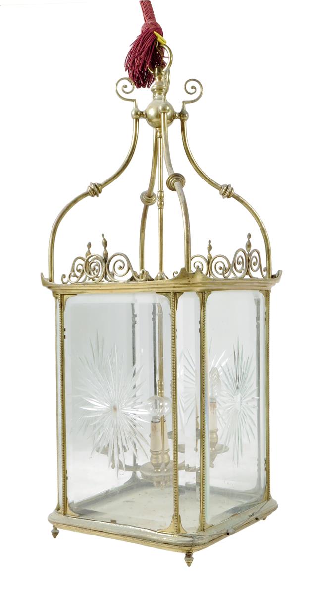 A late 19th century gilt brass hall lantern, with four cut and bevelled glass panels with beaded