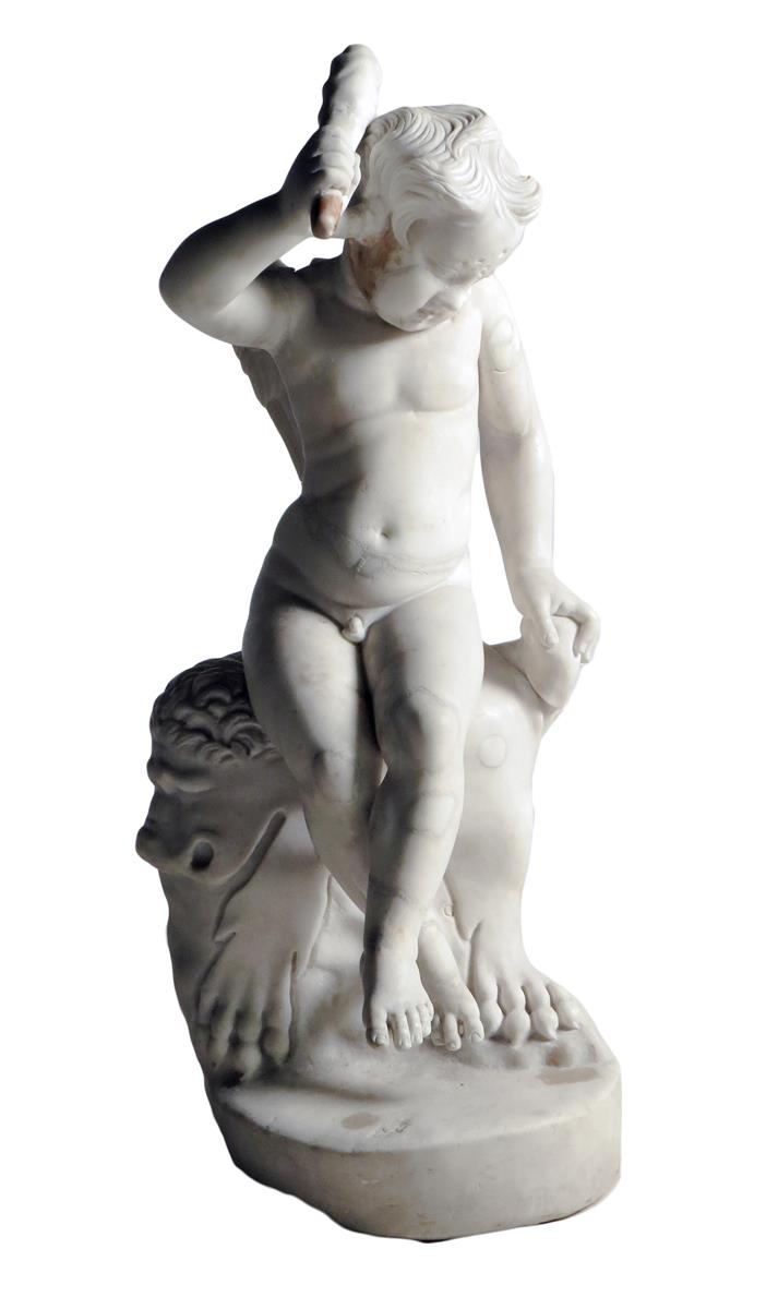 A 17th century Italian carved marble group of the infant Hercules, the winged figure holding a