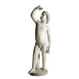 A 19th century marble sculpture of a young Bacchus, wearing a crown of vine leaves and grapes and