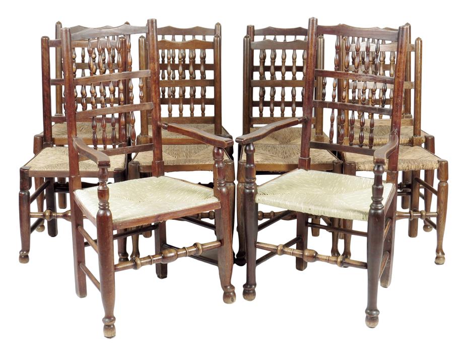 A harlequin set of Lancashire ash and fruitwood dining chairs, each with a spindle back above a rush