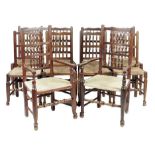 A harlequin set of Lancashire ash and fruitwood dining chairs, each with a spindle back above a rush