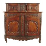 A late 18th century French Provence walnut buffet a glissant, the raised top with a pair of panelled