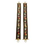 A pair of Victorian beadwork bell-pulls, each decorated with bead and raised work flowers and