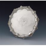 A George III silver salver, by Thomas Hannam and Richard Mills, London 1764, circular form, shell