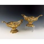 A matched pair of late-Victorian and Edwardian silver-gilt baskets, by George Fox, London 1898 and