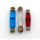 A Victorian silver-gilt mounted double-ended scent bottle, unmarked, cylindrical form, faceted clear