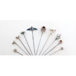 A collection of ten Charles Horner silver hat pins, Chester, various dates, including: a blue/