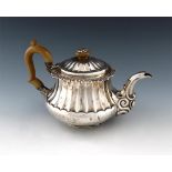A George IV silver teapot, by Jospeh Angell, London 1823, tapering circular bellied form, fluted
