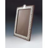 A late-Victorian silver photograph frame, by William Comyns, London 1897, rectangular form, fluted