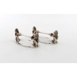 A pair of Edwardian novelty silver rampant lion knife rests, by Hawksworth Eyre and Co, Sheffield