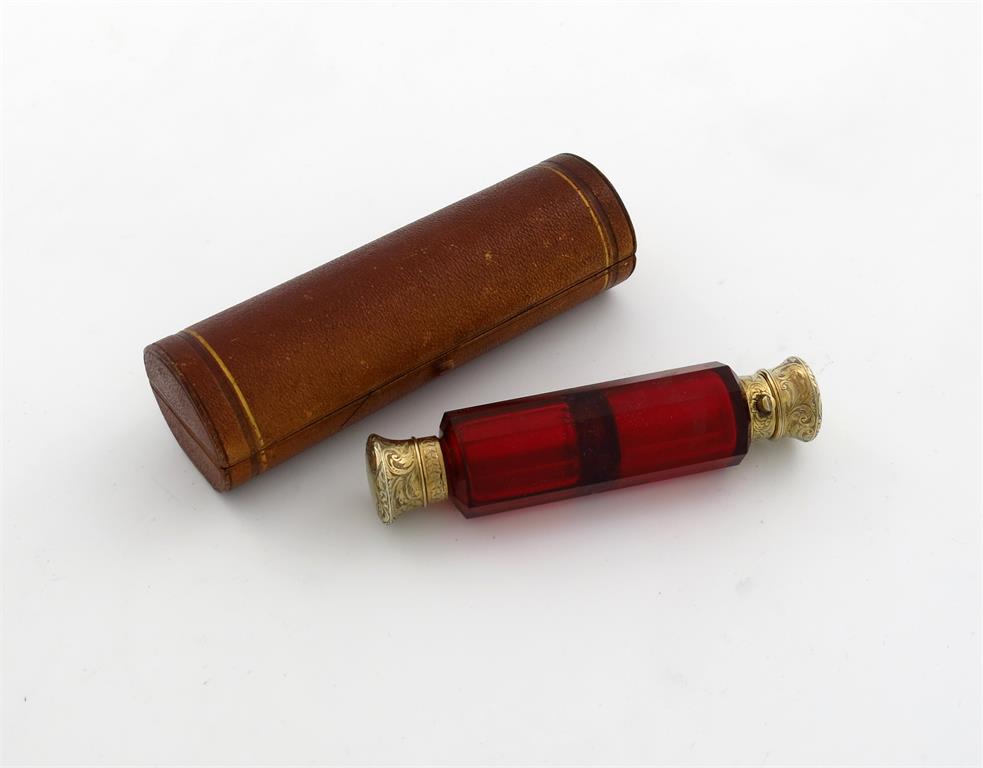 A Victorian silver-gilt mounted red glass double-ended scent bottle, by S. Mordan,  faceted