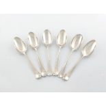 A collection of six 18th century silver Hanoverian Rat-tail pattern tablespoons, comprising: a set