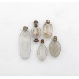 A small collection of four 19th century  silver-mounted  and one gilt-metal mounted scent bottles,