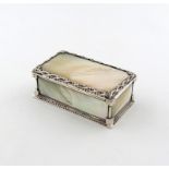 By Omar Ramsden, a silver-mounted and mother of pearl Arts and Crafts box, London 1935, also