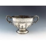 A silver two-handled bowl,  by F and P, London 1922, circular form, central girdle, leaf capped