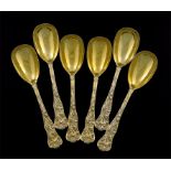 A set of six Victorian silver-gilt Bacchanalian pattern fruit spoons, by Messrs. Lias, London