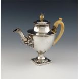 λ A George III silver teapot, probably by Samuel Wood or Samuel White, London 1773, vase form, ivory