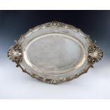 A George II silver meat platter, by Edward Wakelin, London 1748, oval form, shell and gadroon