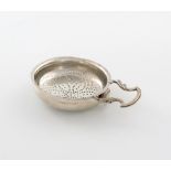 A George III silver lemon strainer, maker's mark partially worn ?M, London 1774, circular form, with