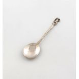 By John Paul Cooper, an Arts and Crafts silver spoon, London 1922, oval bowl, spot-hammered