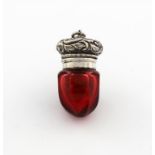 A Victorian silver and red glass vinaigrette, unmarked,  tapering faceted form, the hinged cover