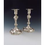 A pair of Victorian cast silver candlesticks,  by Richard Sibley, London 1839, in the Rococo manner,