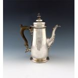 A George II silver coffee pot, marks worn, London 1744, tapering circular form, domed hinged cover