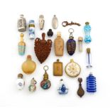 A collection of scent bottles, various materials, including: a ceramic shell scent bottle, one