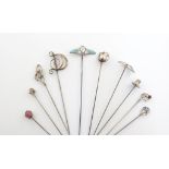 A collection of ten Charles Horner silver hat pins, Chester, various dates, including: a blue/