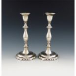 A pair of modern silver candlesticks, by B and H, London 1979, knopped baluster stems, urn shaped