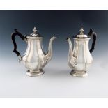 A pair of William IV silver coffee pots, by John Wrangham and William Moulson, London 1833, lobed