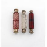 A Victorian silver-mounted double-ended scent bottle, unmarked, cylindrical form, hobnail cut