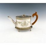 A George III parcel-gilt silver teapot and stand, by Daniel Smith and Robert Sharp, London 1783,