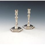 A pair of George II silver taper sticks, by Humphrey Payne, London 1733, hexagonal tapering stems,