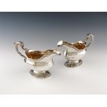 A pair of George II silver sauce boats, by Edward Wakelin, London 1756, oval bellied form, leaf