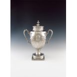 A George III silver two-handled cup and cover, by Thomas Heming, London 1770, vase form, part fluted