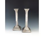 A pair of silver candlesticks,  by Britton, Gould and Co, Birmingham 1926, Corinthian column form,