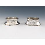 A matched pair of George II silver trencher salt cellars, one by Edward Wood, London 1731, the other