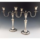 A pair of silver two-light candelabra, by H. Atkins, Sheffield 1929, tapering octagonal form,