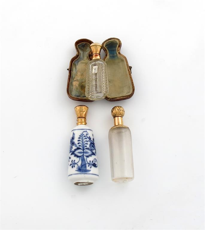 A 19th century French gold mounted scent bottle, tapering oval form, cut-glass decoration, plain