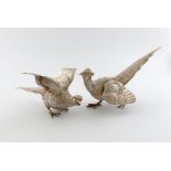 A matched pair of German cast silver pheasants, by Neresheimer of Hanau, with import marks for