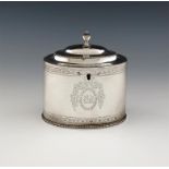 A George III silver tea caddy, by Hester Bateman, London 1783, oval form, bright-cut decoration,