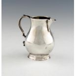 A George II silver 'sparrow beak' cream jug, by Richard Gurney & Co, London 1729, baluster form,