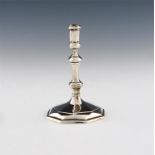 A Queen Anne taper stick, by David Green, London 1713, octagonal baluster stem, on a raised