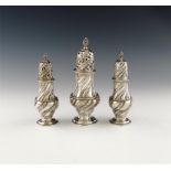 A suite of three George III silver casters, by Robert Piercy, London 1767,  fluted swirl baluster